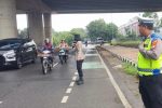 Pelayanan Pagi Restro Tangerang Kota, Polisi Lakukan Pengaturan Lalu Lintas di jalan jalan padat lalu lintas